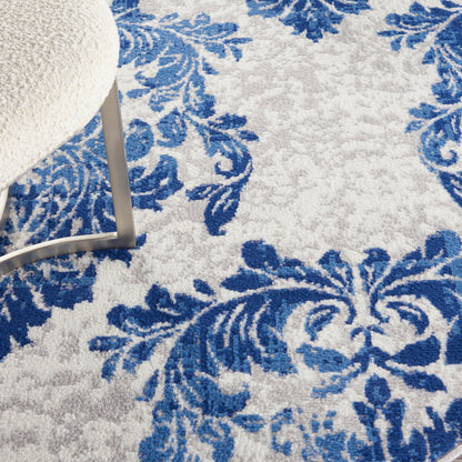 Tapis Nourison Whimsicle style campagne française, motif botanique, ivoire et marine