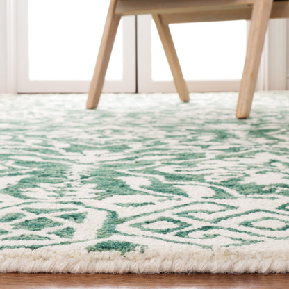 Tapis en laine Elvedina à motif floral, teint à la main par SAFAVIEH