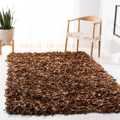 Tapis décoratif moderne SAFAVIEH en cuir shaggy fait main Doinita
