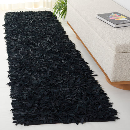 Tapis décoratif moderne SAFAVIEH en cuir shaggy fait main Doinita