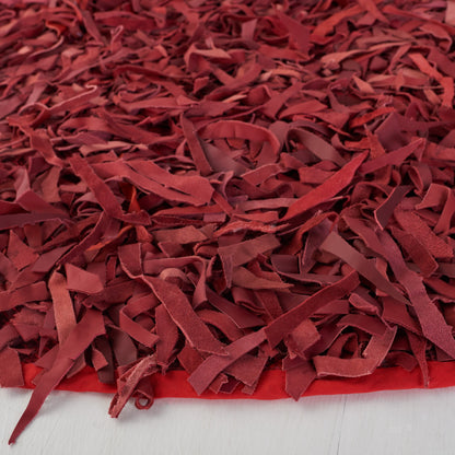 Tapis décoratif moderne SAFAVIEH en cuir shaggy fait main Doinita