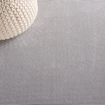 Tapis uni SAFAVIEH Revive Avie