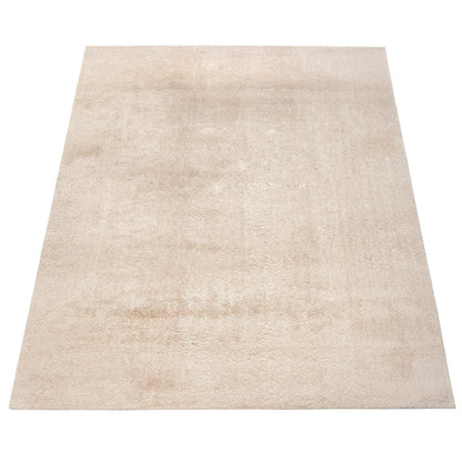 Tapis doux et lavable avec envers antidérapant, disponible en couleurs unies.