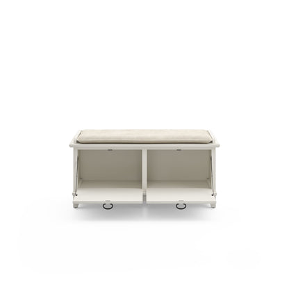 Le banc de rangement rembourré en vieille pierre de la grange grise